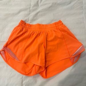 Lululemon Orange Hotty hot 4 inch shorts… low rise Orange… size 4